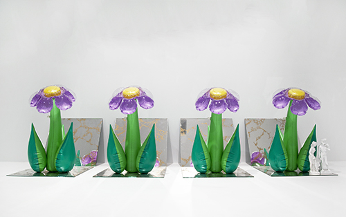 Inflatable Flowers (Four Tall Purple with Plastic Figures)